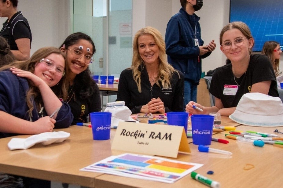 April Arzen sitting with girls at Girls Going Tech